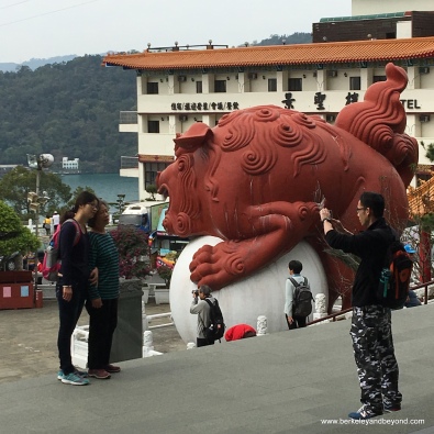 TAIWAN-Sun Moon Lake-Wenwu Temple-guardian lion-taking picture-c2016 Carole Terwilliger Meyers-watermark.JPG